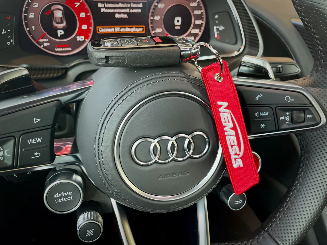 Nemesis Remove Before Flight Keychain